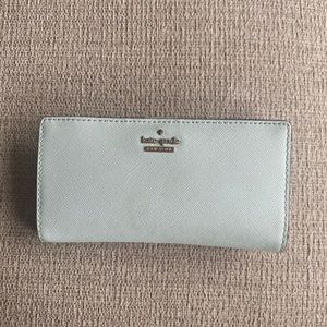 Light blue Kate Spade bifold wallet.